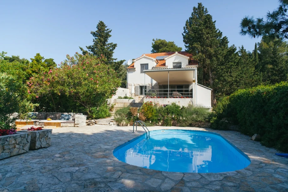 A beautiful Villa Bol Retreat on Brac with a refreshing swimming pool and a cozy patio, ideal for enjoying sunny days and gatherings.