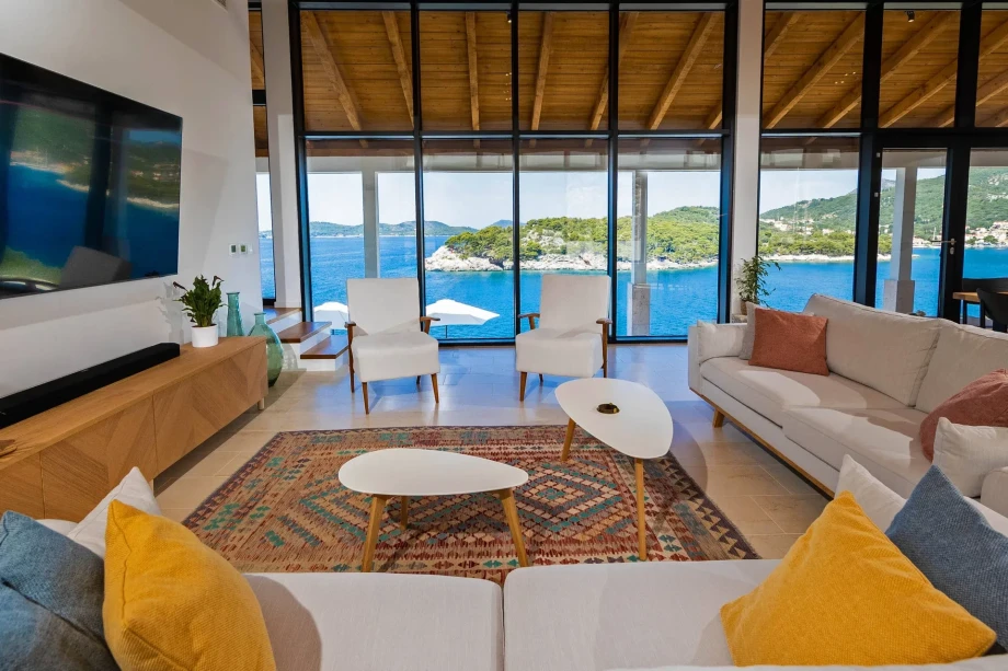 A spacious living room that offers an open view of the sea.