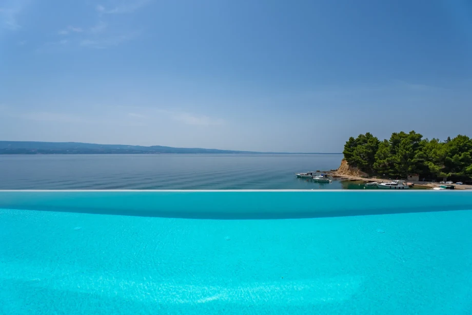 The view from the infinity pool overlooks the sea and the island of Brač