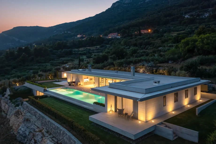 Exterior night view of Luxury Villa Floora with illuminated pool in Kastela near Split