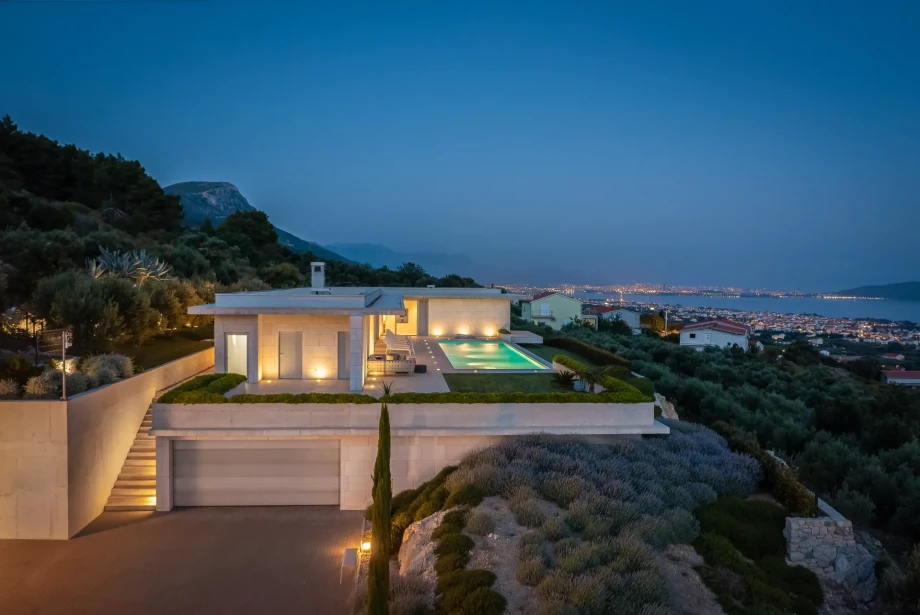 Exterior night view of Luxury Villa Floora with private heated pool and Mediterranean garden
