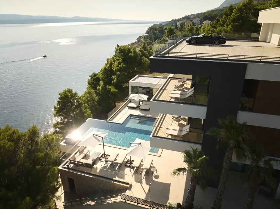 Aerial view of luxury Villa Muse with pool and sun loungers in Omis