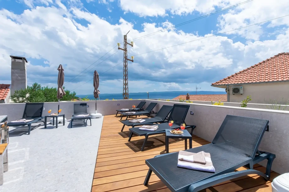 Sun loungers by the heated pool of big villa for families and friends near Split