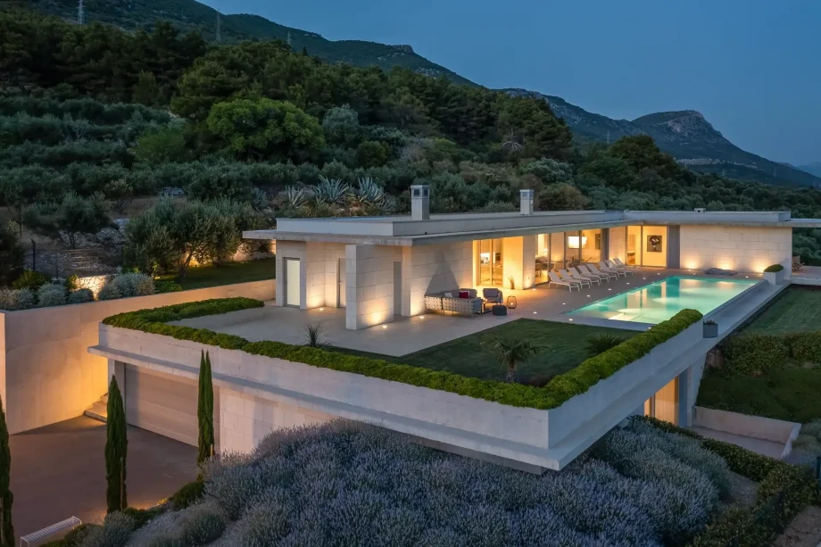 Exterior night view of Luxury Villa Floora with private heated pool and Mediterranean garden