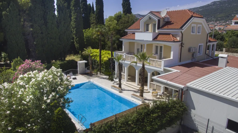 Luxurious villa with a swimming pool and expansive garden, perfect for a relaxing getaway in Croatia's stunning landscapes.