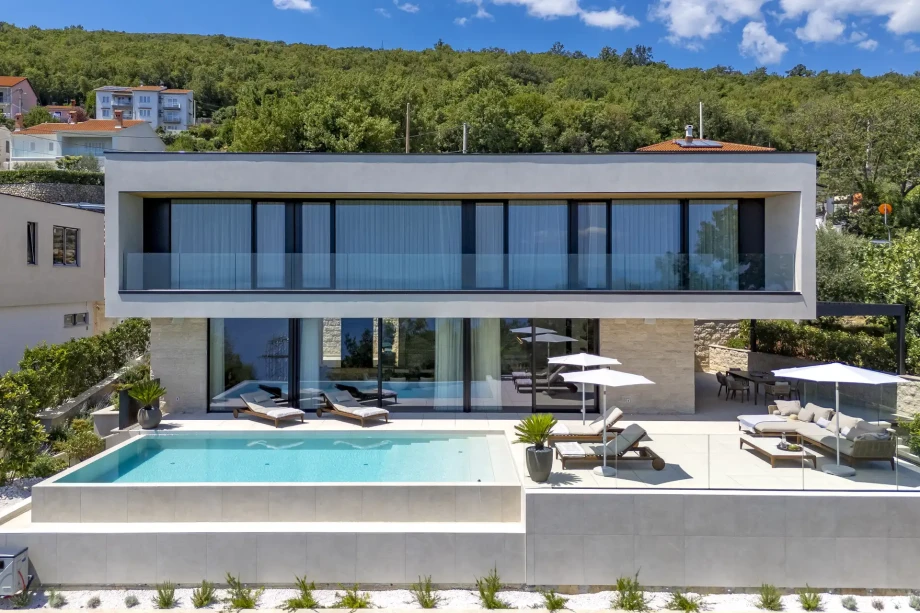 Contemporary villa with a stunning pool and terrace, ideal for enjoying the beautiful Croatian landscape.