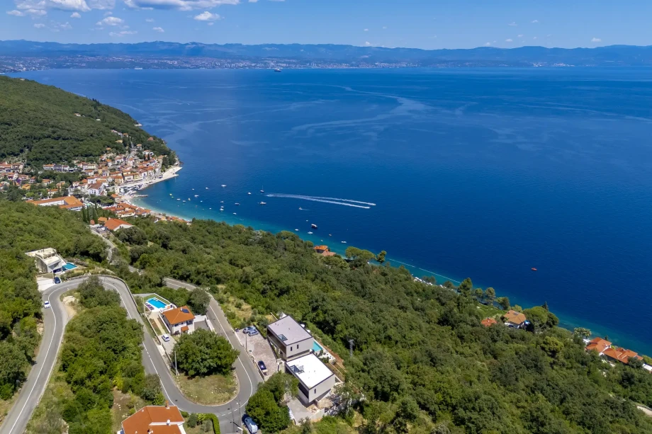 Aerial view of stunning Kvarner Bay, showing a serene blue Adriatic sea.