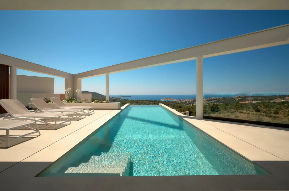 Modern swimming pool at Villa Serena, Primosten, with stunning sea views, perfect for a luxurious Croatian getaway.