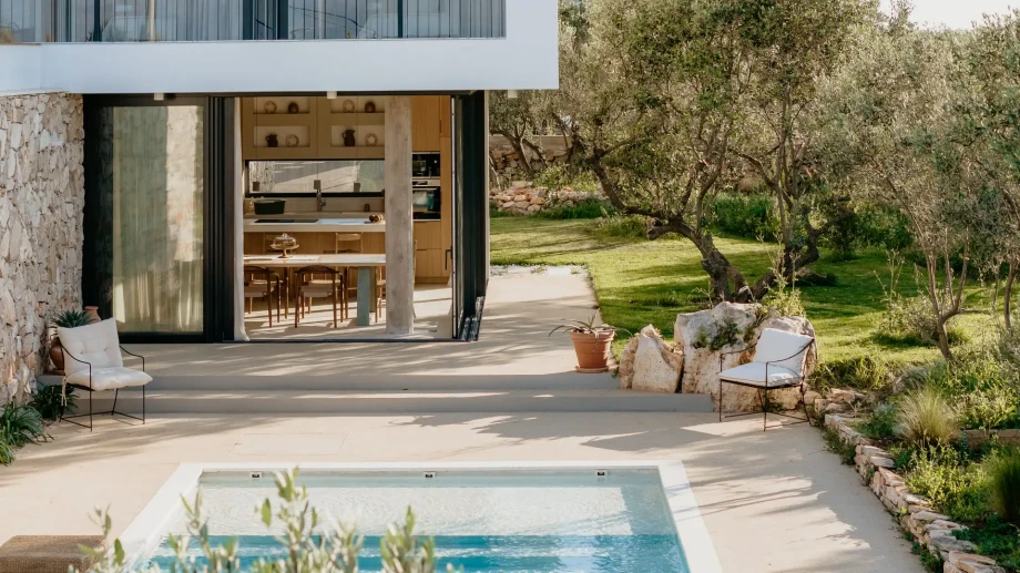 Contemporary Villa Oliveto on Solta Island features a pool and a relaxing outdoor patio space.