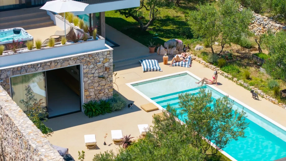 Luxurious Villa Oliveto with a pool and sun loungers, captured from above on Solt Island, Croatia.